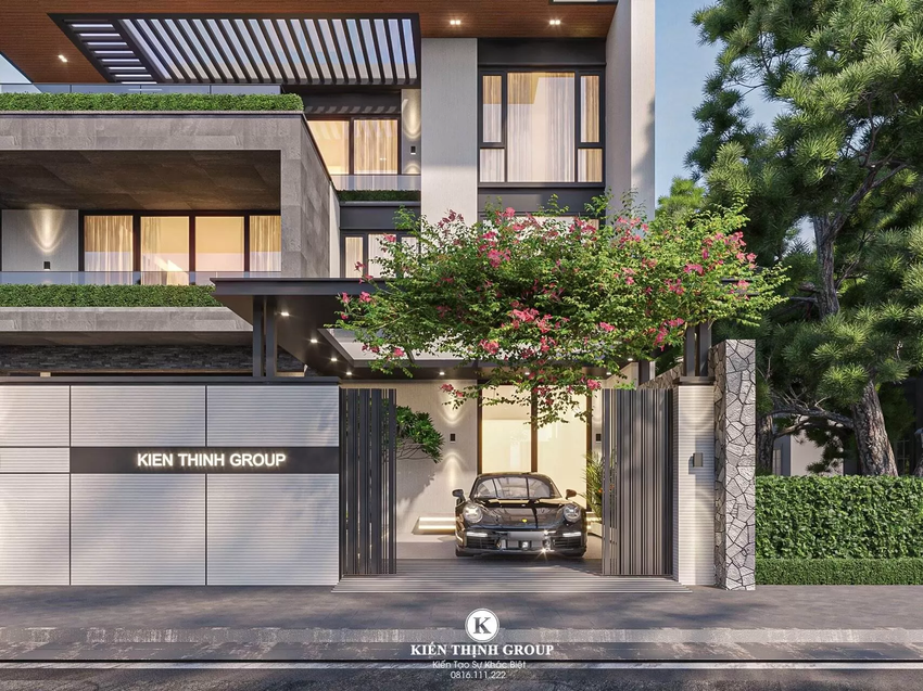 Phần cổng vào là gara để xe được trang trí bằng cây xanh giúp tạo điểm nhấn